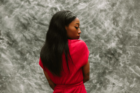 Profile Portrait Of Woman Posing Over Grey Background Profile Portrait Of Woman Posing Over Grey Background