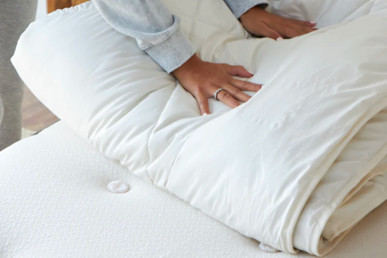 Avocado Alpaca Duvet Insert (Lightweight) with tester's hand to check on how soft it is