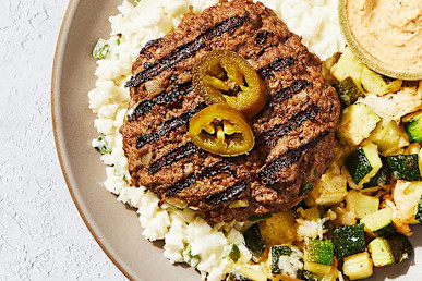 grilled burger on califlower rice with zuchinni