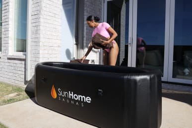 sun home saunas portable tub set up with tester putting towel nearby