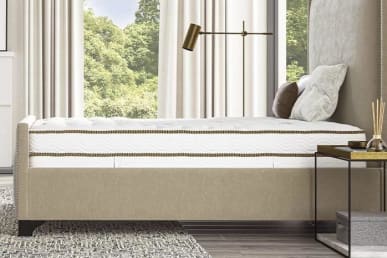 Saatva classic innerspring mattress on bedframe