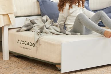 Avocado Eco Organic Kids Mattress in a bedroom with a child