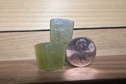 Charlottes web gummies next to penny to show size