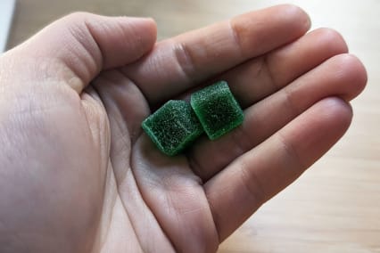 Naternal Delta 9 launch gummies in hand two green gummies