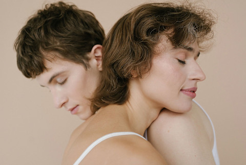 Androgynous couple hugging