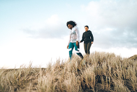 Women Walking Outdoors on a Windy Day