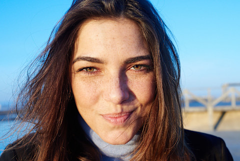 Lovely Girl With Brunette Hair And Freckles Smiling At Camera. Lovely Girl With Brunette Hair And Freckles Smiling At Camera.