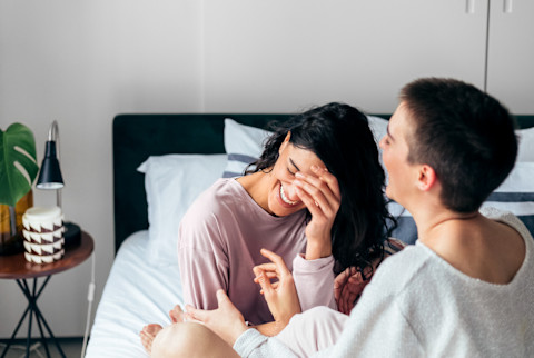 Couple Laughing Together In Bed Couple Laughing Together In Bed