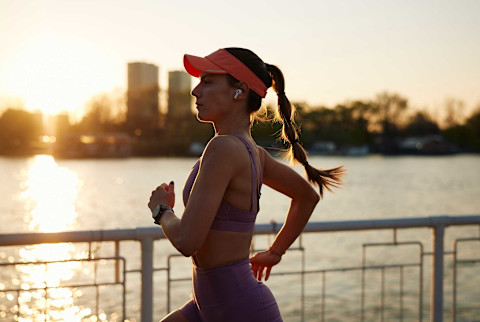 Woman running at sunset Woman running at sunset