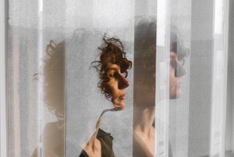 A profile of a young curly girl performed in long exposure A profile of a young curly girl performed in long exposure