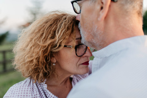 Middle Aged Couple Enjoying An Intimate Moment Together Middle Aged Couple Enjoying An Intimate Moment Together