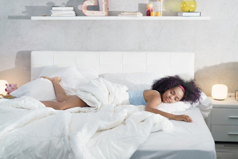 Woman sleeping in bed Woman sleeping in bed