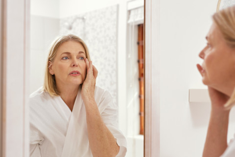 middle aged woman in a mirror