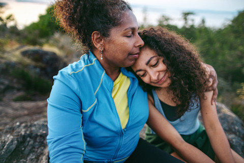 Mother And Daughter Hiking Together At Sunset Mother And Daughter Hiking Together At Sunset