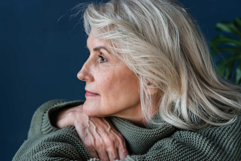 older woman looking into the distance