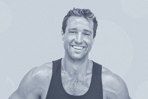 Man smiling wearing black tank top with a blue overlay