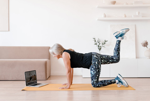 Older woman working out at home Older woman working out at home