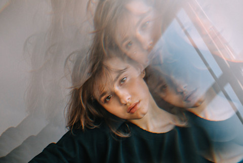 Moody Young Woman Looking to Camera with a Prism Overlay Moody Young Woman Looking to Camera with a Prism Overlay