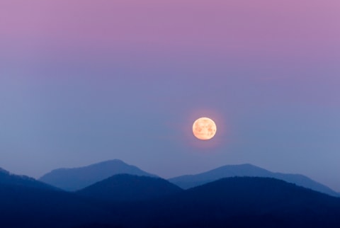 moon over mountains and night sky