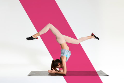 woman doing forearm stand yoga pose