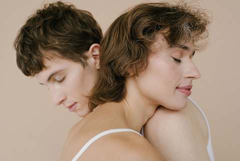 Androgynous couple hugging