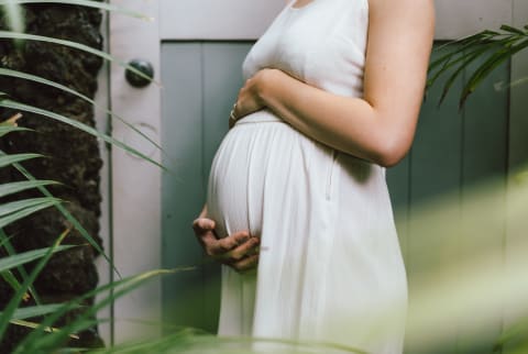 Pregnant Woman Holding Her Baby Bump
