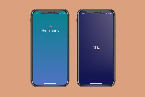 Two phones showing the Match and the eharmony logos on the screens.