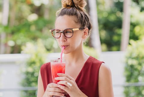 Woman Drinking A Smoothie At Home