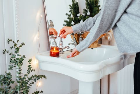 Anonymous woman washing hands