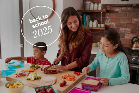 Back To School 2025: Mom helping kids pack lunch with logo
