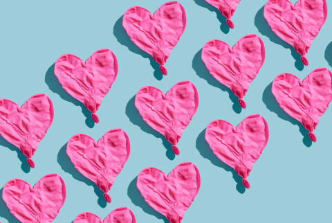 Deflated Balloon Hearts on a Blue Background Deflated Balloon Hearts on a Blue Background