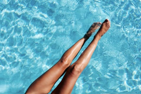 tan legs in pool