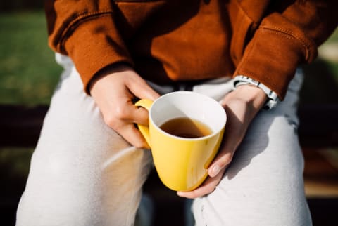 Woman Holding a Cup of Tea Woman Holding a Cup of Tea
