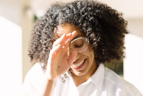 Woman in light smiling