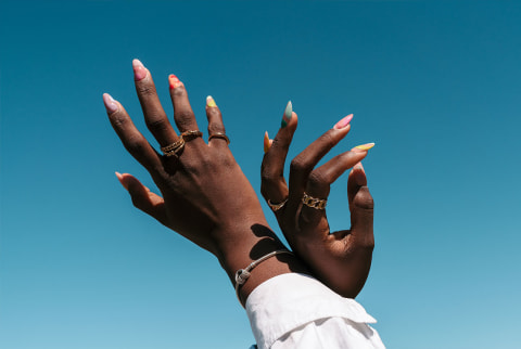 black womans hands in the sky