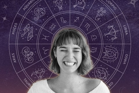 woman smiling with mystical zodiac wheel behind her head