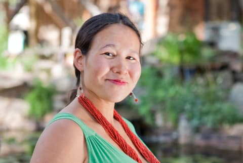 indigenous woman with lipstick on smiling