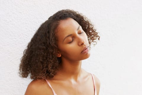 Woman looking thoughtful in cami