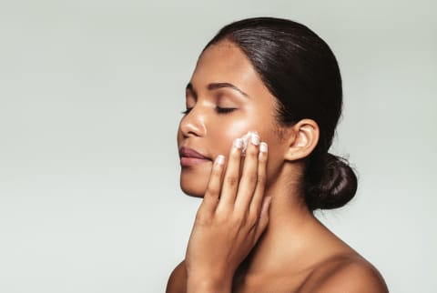 woman applying skin care