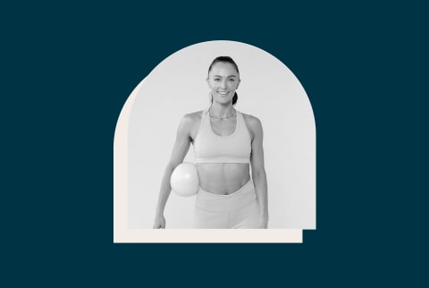 black and white image of woman in workout clothes holding exercise ball on navy blue background