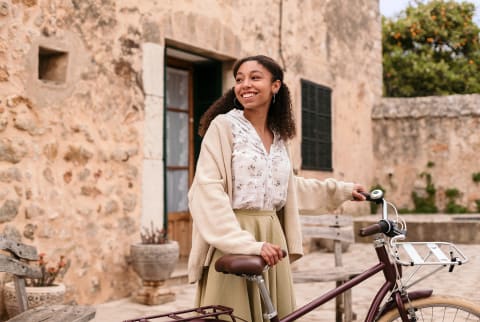 woman smiling with bike