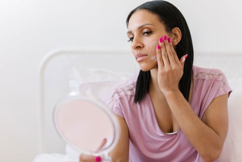 woman applying face cream