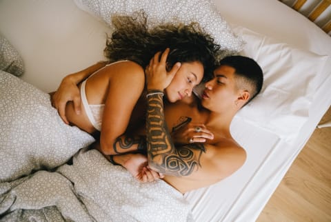 Couple Embracing in Bed