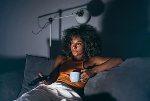 Woman Watching TV at Night