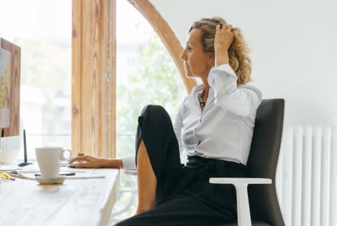 Business Woman Working At Her Desk