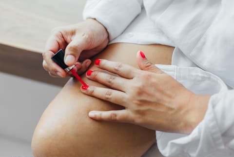 woman painting nails