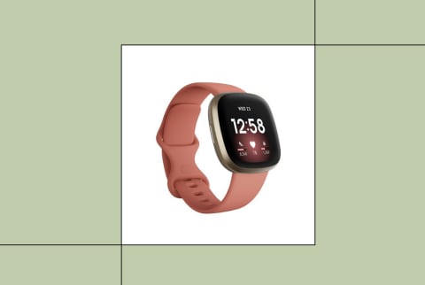 Fitbit sleep tracker on green background
