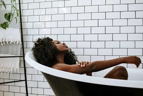 Woman Enjoying a Bath Woman Enjoying a Bath