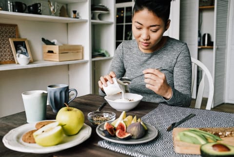 Woman Eating Healthy Breakfast