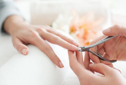 woman cutting nails